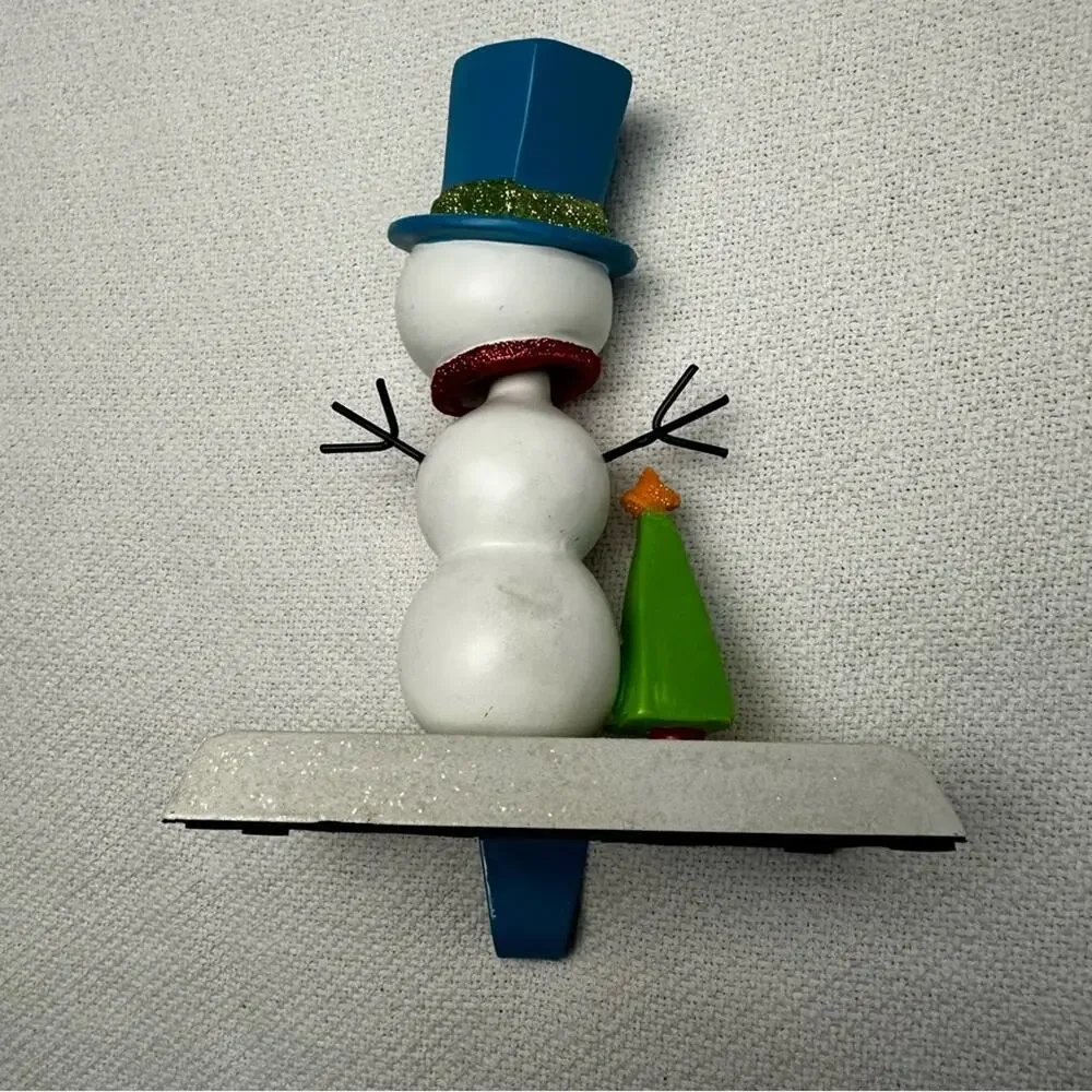 Snowman bobble head stocking holder